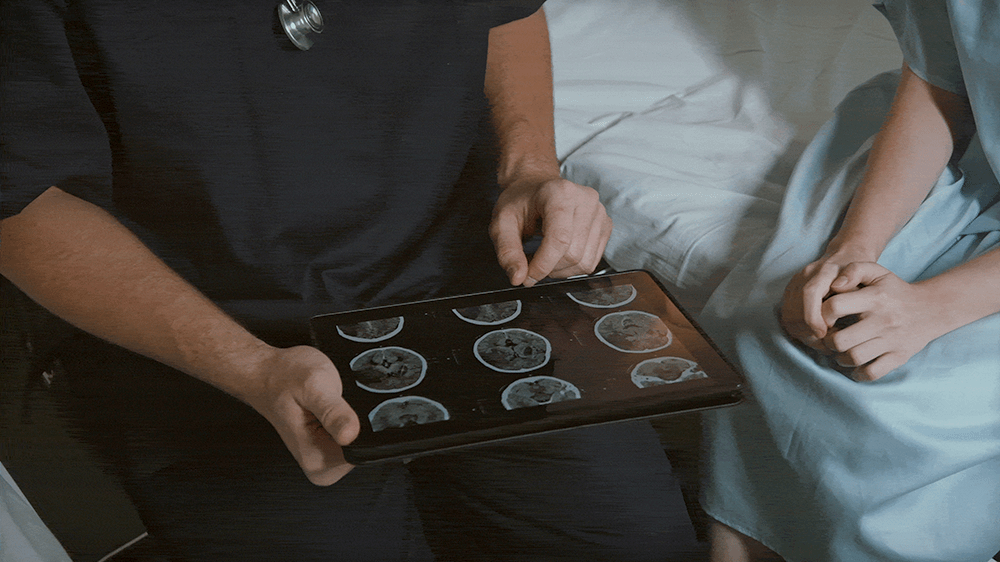 A doctor checking a patient's scans